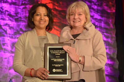 Dr. McKenzie receiving award
